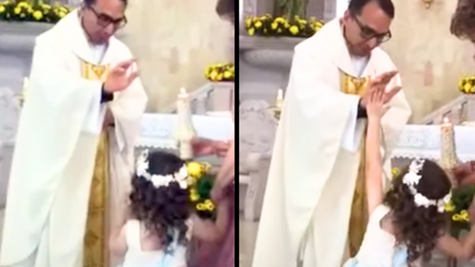 Girl “High Fives” Priest As He Reaches Out To Bless Her